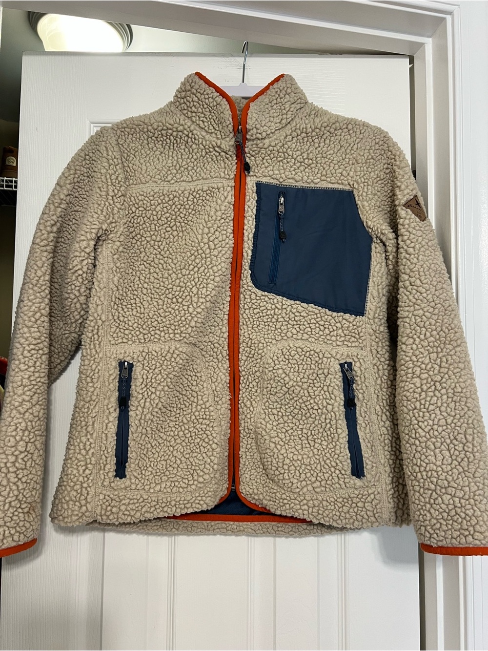 Eddie Bauer Cream Sherpa Jacket with Navy Pockets and Orange Trim